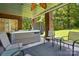 Covered patio with a hot tub and outdoor seating at 221 Grayrock Dr, Statesville, NC 28677