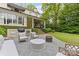 Landscaped backyard featuring an outdoor grill, patio furniture and a well manicured lawn at 2322 Hopedale Ave, Charlotte, NC 28207