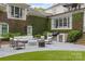 Stylish patio with comfortable seating, an outdoor grill and lush green surroundings, perfect for entertaining guests at 2322 Hopedale Ave, Charlotte, NC 28207