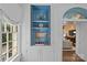 Elegant bar area showcasing display shelving, white cabinetry, and refined decor at 2322 Hopedale Ave, Charlotte, NC 28207