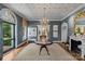 Elegant foyer boasts grasscloth walls, hardwood floors, transom windows, and a cozy marble fireplace at 2322 Hopedale Ave, Charlotte, NC 28207