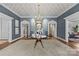 Grand foyer featuring patterned wallpaper, hardwood floors, arched doorways, and a stunning chandelier at 2322 Hopedale Ave, Charlotte, NC 28207