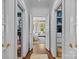 Hallway leading to bedroom and closet with ample storage with safe at 2322 Hopedale Ave, Charlotte, NC 28207