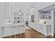 Bright kitchen with a marble island, stainless steel appliances, white cabinets, and pendant lighting at 2322 Hopedale Ave, Charlotte, NC 28207
