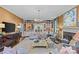 Bright living room features a fireplace, custom built-ins, large windows, and comfortable seating at 2322 Hopedale Ave, Charlotte, NC 28207