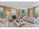 Inviting living room features a fireplace, beautiful decor, large windows, and comfortable seating at 2322 Hopedale Ave, Charlotte, NC 28207