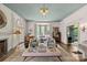 Bright living room features fireplace, large windows, and open concept at 2322 Hopedale Ave, Charlotte, NC 28207