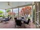 Outdoor patio with brick flooring, seating area, and views of the backyard at 2322 Hopedale Ave, Charlotte, NC 28207