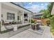 Beautiful backyard features a covered patio with seating and a grill, perfect for outdoor entertainment at 2509 Bay St, Charlotte, NC 28205