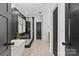 Modern bathroom featuring a glass-enclosed shower, free standing tub, and stylish tile flooring at 2509 Bay St, Charlotte, NC 28205