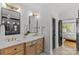 Bright bathroom featuring double sink vanity with modern lighting and elegant white countertops at 2509 Bay St, Charlotte, NC 28205
