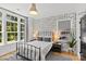 Charming bedroom featuring unique vehicle-themed wallpaper and a large window with natural light at 2509 Bay St, Charlotte, NC 28205