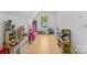 Sunlit playroom featuring wood flooring, lots of toys, and a sunny window view at 2509 Bay St, Charlotte, NC 28205