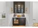 Elegant butler pantry with glass-front cabinets, wine storage, a beverage cooler, and designer lighting at 2509 Bay St, Charlotte, NC 28205
