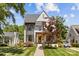 Charming two-story home featuring a manicured lawn and inviting front porch at 2509 Bay St, Charlotte, NC 28205