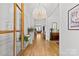 Elegant foyer featuring hardwood floors, a modern chandelier, and decorative accents at 2509 Bay St, Charlotte, NC 28205