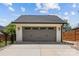 Two car garage with gray doors, black accents, black carriage door hardware and concrete driveway at 2509 Bay St, Charlotte, NC 28205
