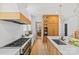 Updated kitchen boasts stainless steel appliances, custom cabinets, a butcher block island and a modern design at 2509 Bay St, Charlotte, NC 28205