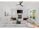 Cozy living room features a fireplace, large windows, a neutral color palette, and modern furnishings at 2509 Bay St, Charlotte, NC 28205