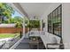 Inviting outdoor living space with a large white sectional and striped rug for relaxing outdoors at 2509 Bay St, Charlotte, NC 28205