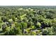 Scenic aerial view of a community with mature trees and lush green golf course at 2608 Carmarthen Ct, Matthews, NC 28104