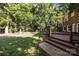 A beautifully landscaped backyard has a spacious deck and a lush lawn at 2608 Carmarthen Ct, Matthews, NC 28104