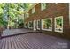 A spacious backyard has a large wooden deck, ideal for outdoor entertaining at 2608 Carmarthen Ct, Matthews, NC 28104