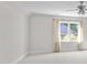 A spacious bedroom has crown molding, a ceiling fan, and light-filled windows at 2608 Carmarthen Ct, Matthews, NC 28104