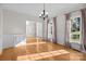 Bright, open dining room with hardwood floors, wainscoting, and large windows at 2608 Carmarthen Ct, Matthews, NC 28104