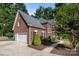 Beautiful two-story brick home with attached garage and manicured landscaping at 2608 Carmarthen Ct, Matthews, NC 28104