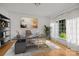 Modern home office with a sleek desk, stylish decor, and a bright window overlooking the garden at 2608 Carmarthen Ct, Matthews, NC 28104