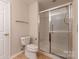 Bathroom featuring a tiled shower with glass door at 2704 Polo Club Blvd, Matthews, NC 28105