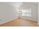 Vaulted ceilings and light wood floors enhance this bright, airy bedroom at 2704 Polo Club Blvd, Matthews, NC 28105