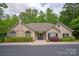 Exterior of the community clubhouse, featuring well maintained landscaping at 2704 Polo Club Blvd, Matthews, NC 28105