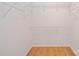 Spacious walk-in closet with wood floors and ample shelving at 2704 Polo Club Blvd, Matthews, NC 28105