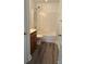 The bathroom has a shower over tub and a wood vanity at 2800 Deans Ct, Monroe, NC 28110