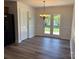 Dining area with modern lighting and French doors that lead to the backyard at 2800 Deans Ct, Monroe, NC 28110