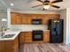 Kitchen with stainless steel appliances, wood cabinets and double sink at 2800 Deans Ct, Monroe, NC 28110