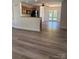 Open-concept kitchen and dining area with stainless steel appliances, granite countertops, and modern finishes at 2800 Deans Ct, Monroe, NC 28110