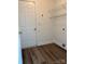 Laundry room with modern flooring, wire shelving, and white walls at 2800 Deans Ct, Monroe, NC 28110