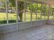 Enclosed sunroom showcasing tiled flooring and views of the backyard at 2800 Deans Ct, Monroe, NC 28110