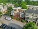 Aerial view of the townhome showcasing a rooftop deck and well-maintained landscaping at 2988 Textile Way, Charlotte, NC 28205