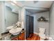 Bathroom featuring a vessel sink with granite countertop, stylish decor, and tiled floors at 2988 Textile Way, Charlotte, NC 28205