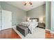 Calm bedroom featuring a plush bed, bench, and hardwood floors, with a neutral decor scheme at 2988 Textile Way, Charlotte, NC 28205