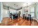 Open kitchen and dining area with modern lighting fixtures and hardwood floors at 2988 Textile Way, Charlotte, NC 28205