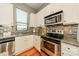 Bright kitchen with stainless steel appliances and granite countertops at 2988 Textile Way, Charlotte, NC 28205