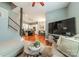 Open-concept living area with hardwood floors, flowing into the kitchen and dining area, perfect for modern living at 2988 Textile Way, Charlotte, NC 28205