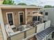 Spacious rooftop deck offers a comfortable lounge area and outdoor dining space with shade at 2988 Textile Way, Charlotte, NC 28205