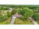 Aerial view of the property, including a brick home and large backyard with mature landscaping at 326 N Greenbriar Rd, Statesville, NC 28625