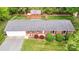 Overhead view of a brick ranch home with a large backyard and detached red outbuilding at 326 N Greenbriar Rd, Statesville, NC 28625